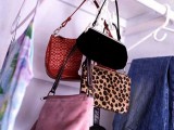 metal hooks in the closet is a a smart idea to hang your bags and not to waist space anywhere