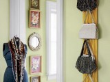 a wooden plank with hooks attached to the wall will hold a lot of bags and is easy to install in any closet