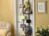 vertical metal holders with hooks attached to a door will hold a lot of bags and will save a lot of space