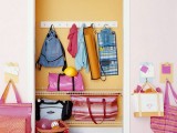 attach some hooks to the walls next to the closet, and your kids will be able to hang their bags there