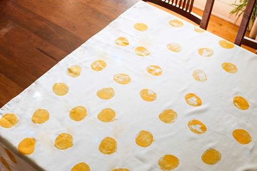 hand-stamped polka dot tablecloth (via hellohomeshoppe)