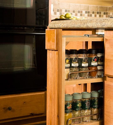 Slim roll-out drawer is perfect to store spices