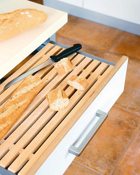 Pull out bread cutting surface is a quite practical solution.