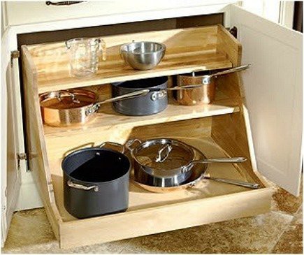 Sliding kitchen cabinet is perfect to organize all these pans and pots and make the access to them an easy task.