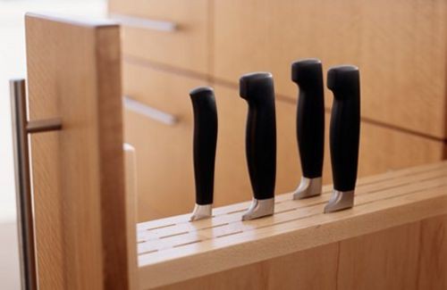 Pull out bottle drawer could become a knife rack.