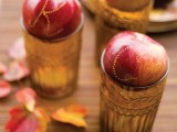 use letters on red apples placed on amber glasses as place cards that are yummy
