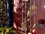 a lovely natural fall hanging of acorns, nuts, apples, cinnamon and pinecones is perfect for the fall