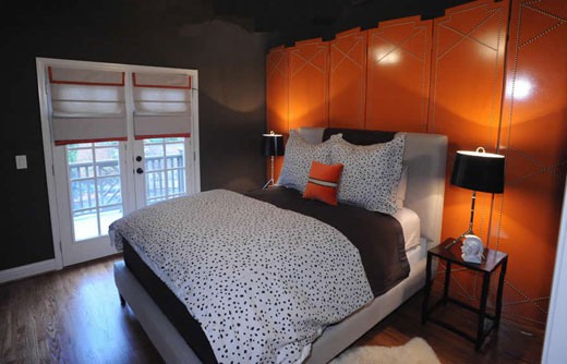 a bright orange folding space divider is a bright colorful statement here and a gorgeous idea to divide spaces