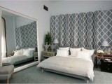 a geometric screen in grey and white is a cool fit for this contemporary bedroom is a stylish idea to add pattern