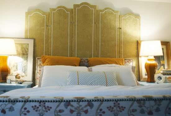 a refined and carved olive green headboard with neutral edging is a chic idea to add a subtle touch of color