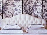 a painted black and white screne headboard adds elegant and chic to the bedroom