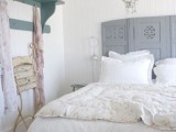 a grey carved space divider is a subtle touch of color and a chic idea to make your bedroom more wow