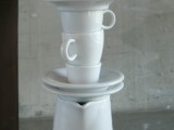 Side Table With One Leg Made Of Tableware