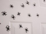 lots of tiny spiders can be attached to a door, a wall or some other surface to make it scary