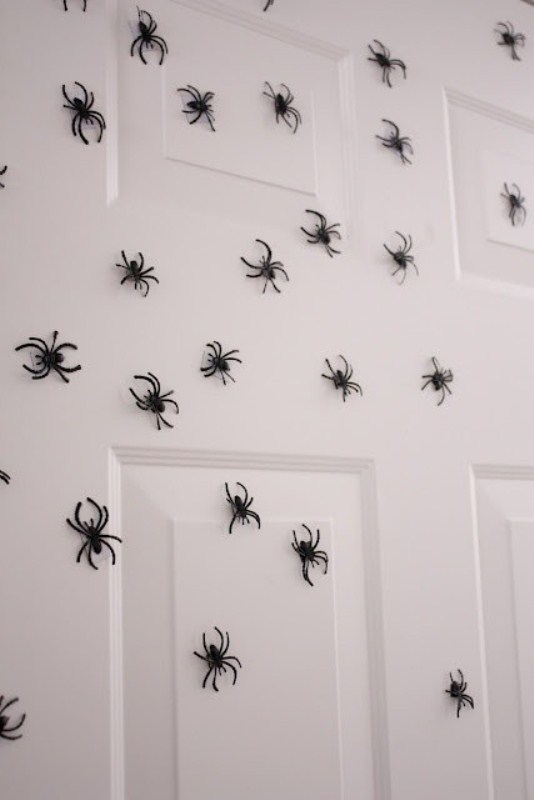 lots of tiny spiders can be attached to a door, a wall or some other surface to make it scary