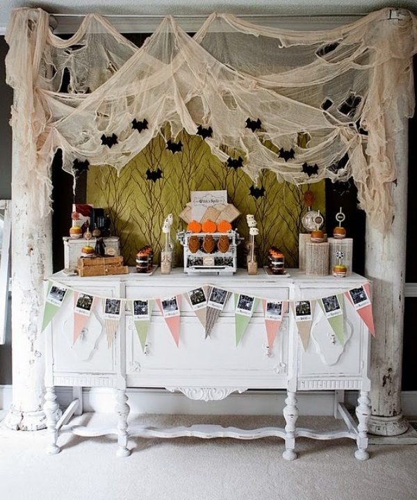 Cheesecloth with bats and spiders hanging over the dessert table will make it look scary and Halloween like