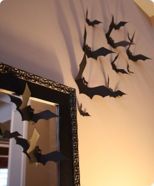 black paper bats decorating the mirror and the wall are amazing for Halloween decorating and won't cost much effort