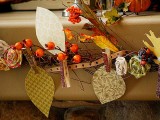 a vintage Thanksgiving garland of fabric leaves, blooms, berries and hearts is a stylish and refined decor idea