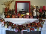 bright candles, wheat bundles, faux pumpkins, cubes and a lush faux leaf wreath with hanging