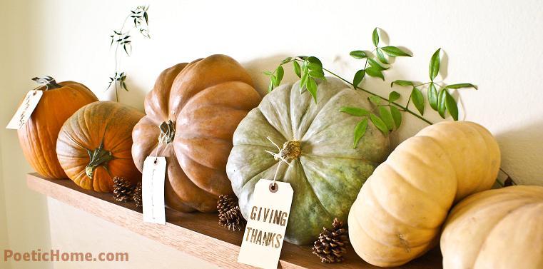 natural pumpkins with tags, pinecones and greenery for stylish rustic Thanksgiving decor