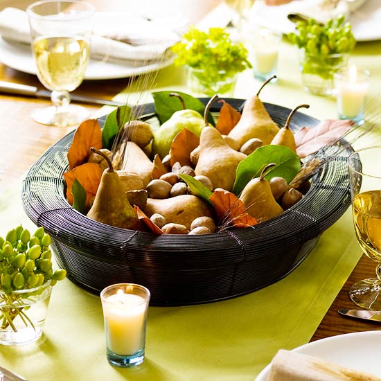 a bowl with pears, nuts, wheat and leaves is a nice fall or Thanksgiving idea of a centerpiece