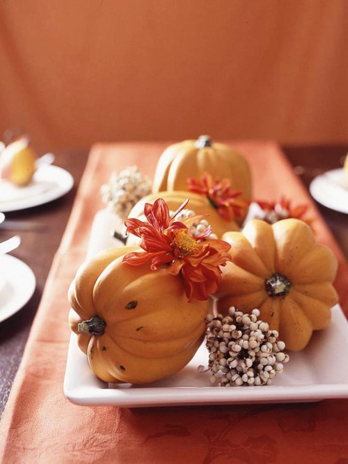 a porcelain tray with pumpkins, blooms and berries is an easy rustic centerpiece for the fall
