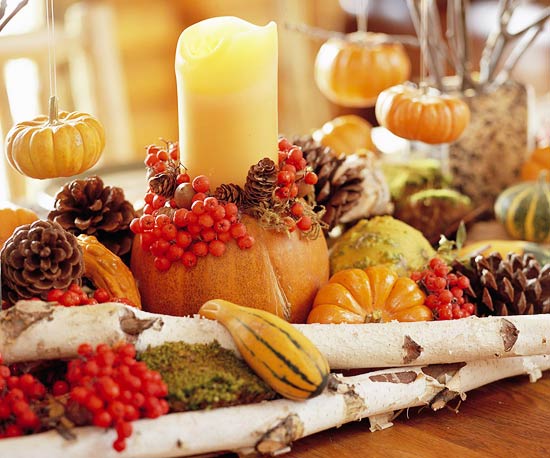 wooden branches, moss, berries, gourds, pumpkins, candles for a woodland Thanksgiving or fall centerpiece
