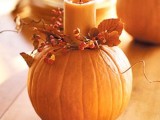 pumpkins with candles and berries are lovely fall decorations or centerpieces, pair them with something else