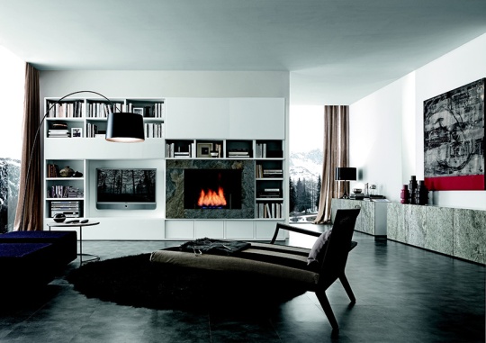 A contemporary living room with white walls, bookshelves, a fireplace and a TV in a niche that looks absolutely organic and cool