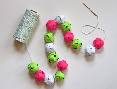 Small but colorful woven balls are perfect to mix and make a garland for a tabletop Christmas tree. (via howaboutorange)